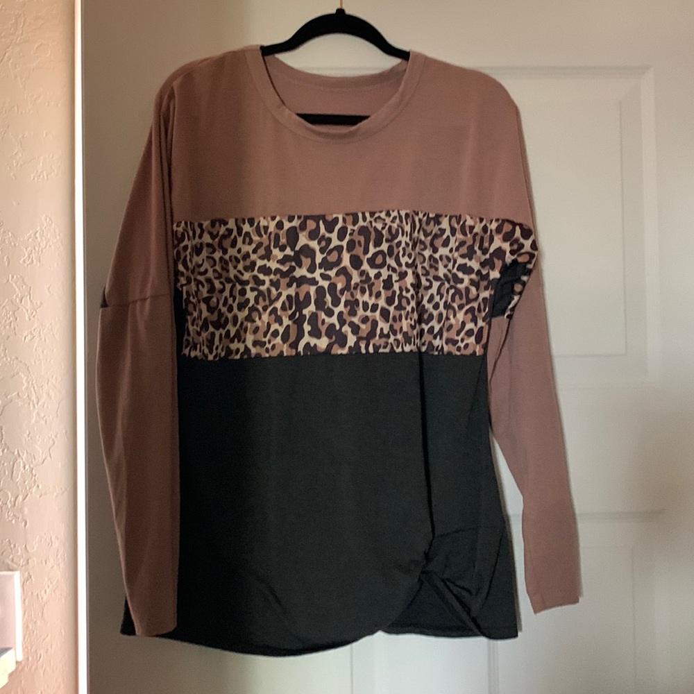 Cute poly cotton blend shirt! Animal stripe across breast area! Long sleeves